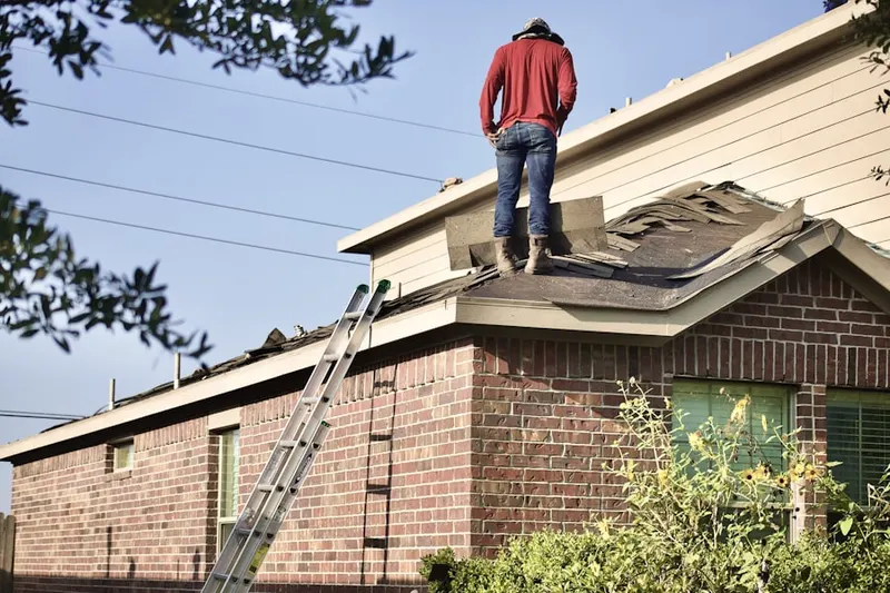 Professional roofer working on a residential roof in East Lakeview